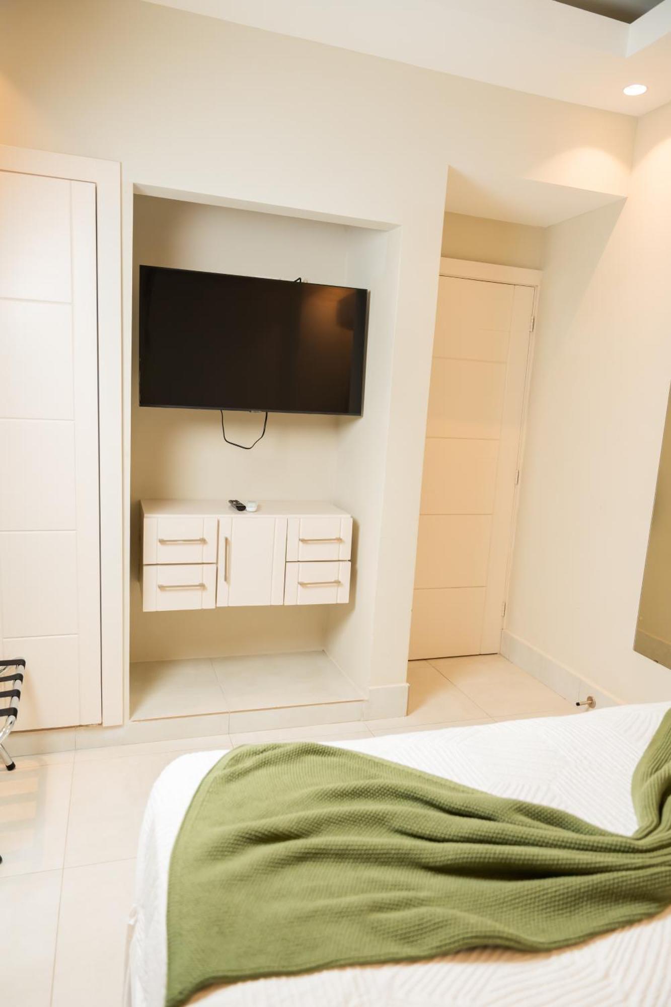 Hotel Stay Here Suites Santo Domingo Pokoj fotografie